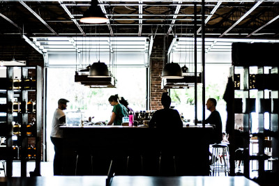 silhouette of customers and bartender in icehouse
